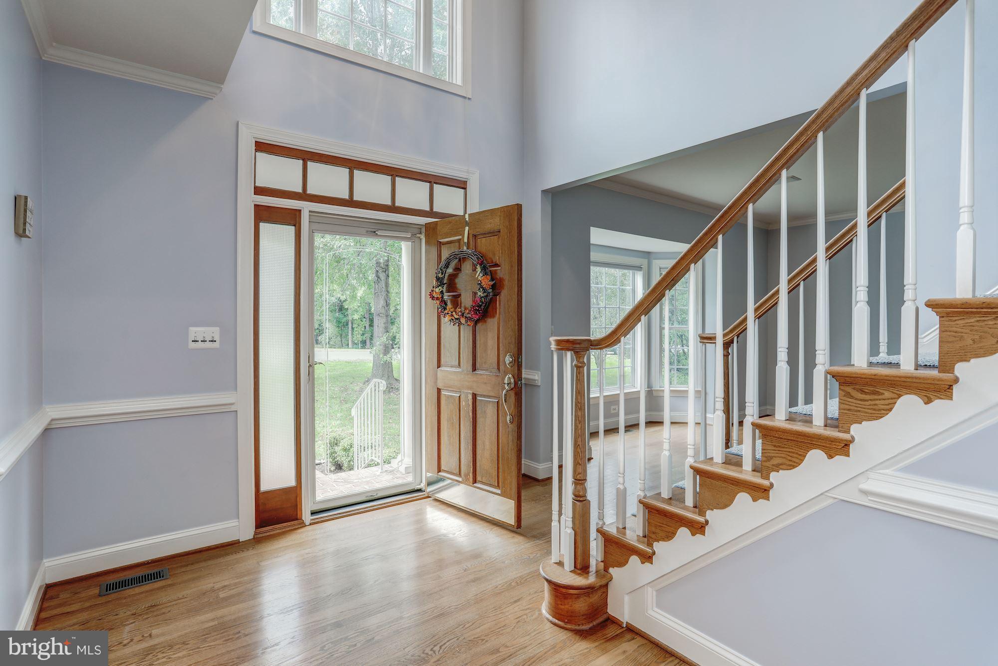 7882 Pembridge Road Manassas, VA 20112 - Photo 3 of 30 Double Story Foyer w L-Shaped Staircase