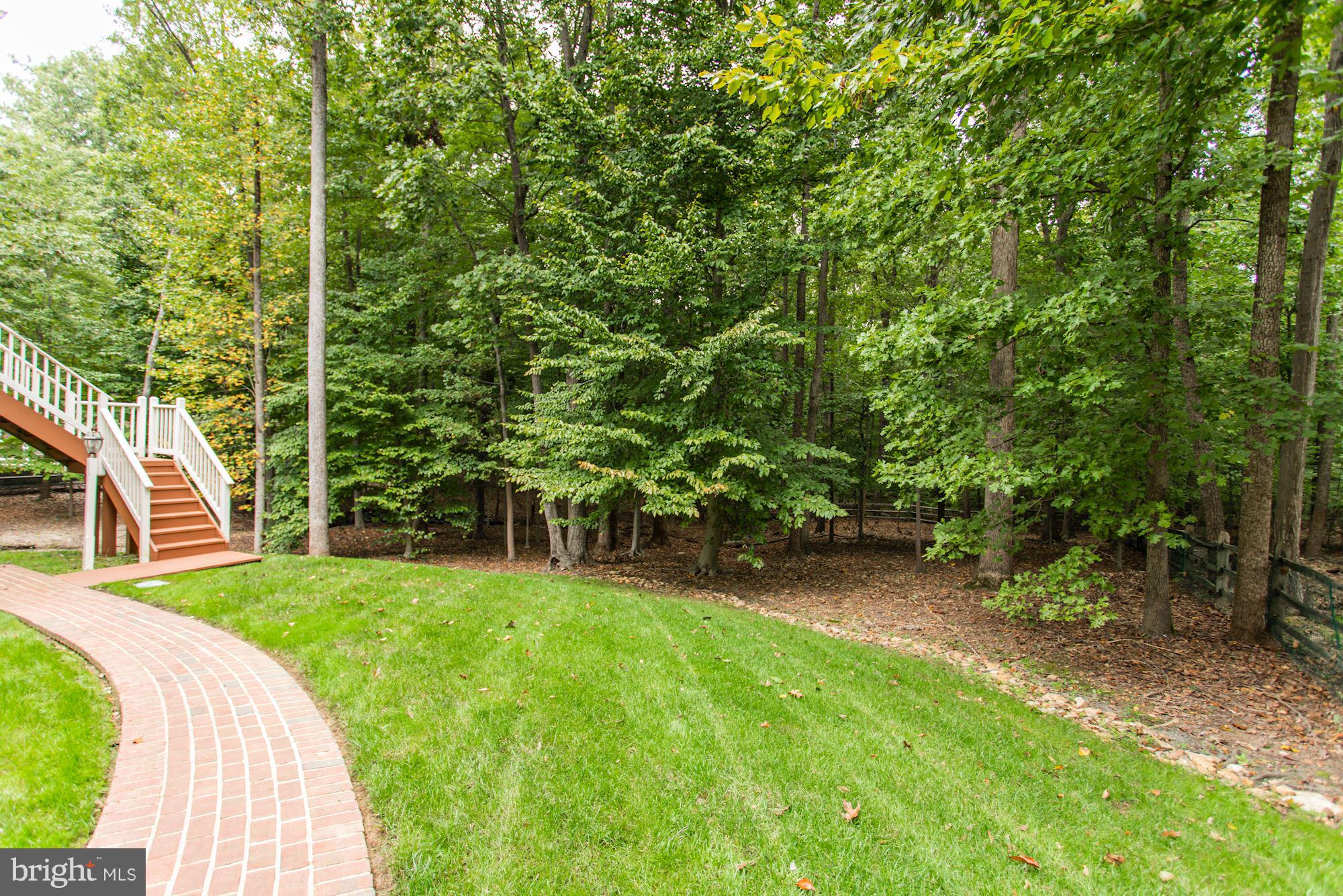 7882 Pembridge Road Manassas, VA 20112 - Photo 29 of 30 Brick Walkway / Backyard / Park-like Setting