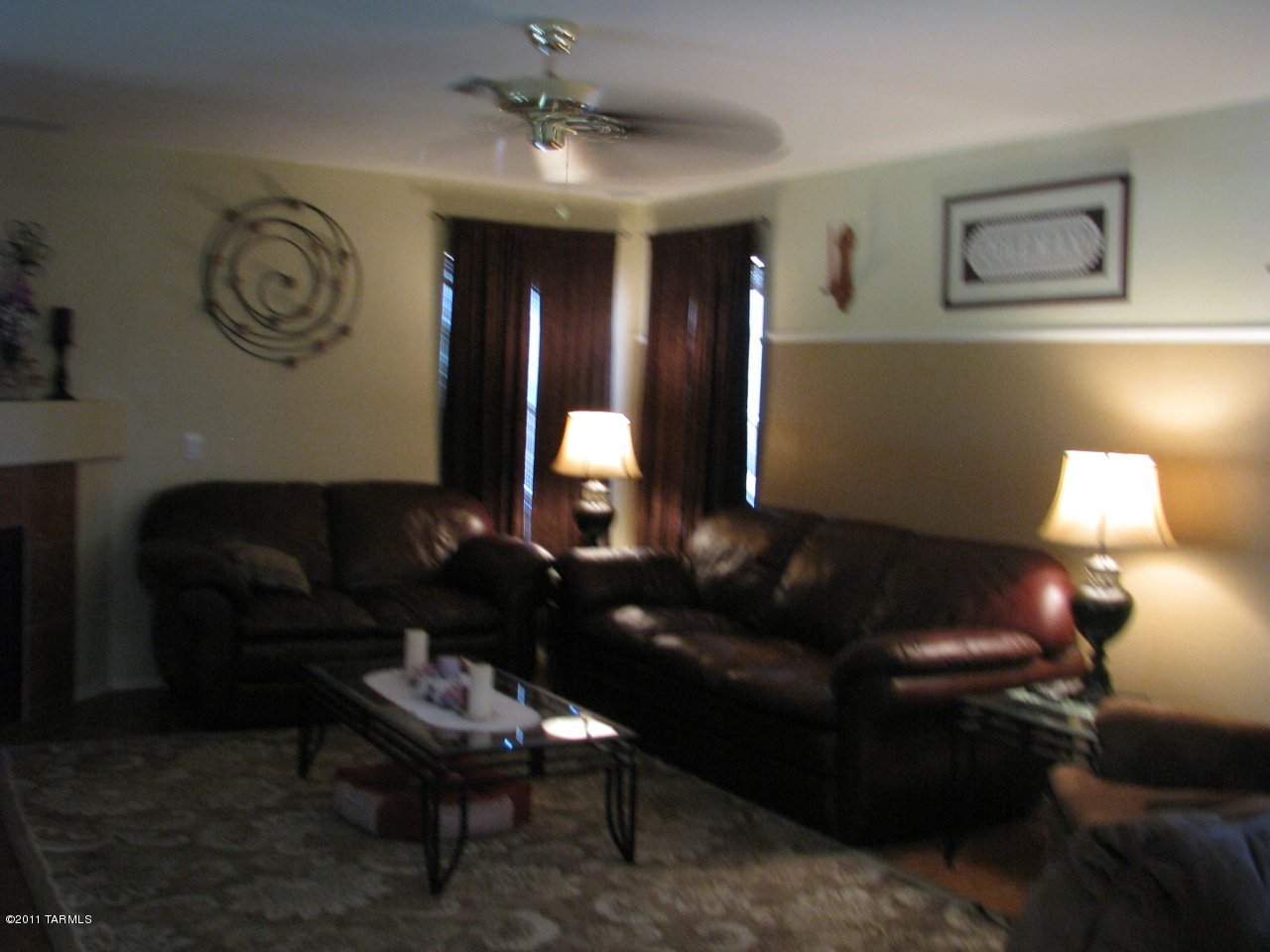 3728 East Mecate Road Tucson, AZ 85739 - Photo 4 of 9 a living room with furniture and a lamp