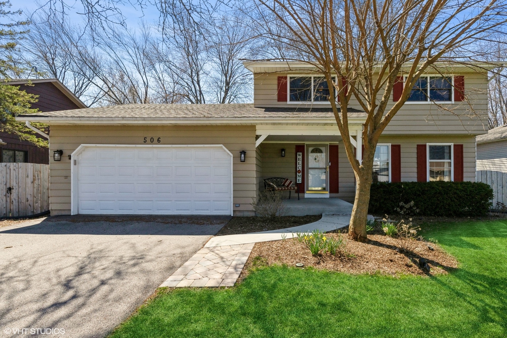 506 Beck Road Lindenhurst, IL 60046 - Photo 1 of 15 a front view of a house with a yard and garage