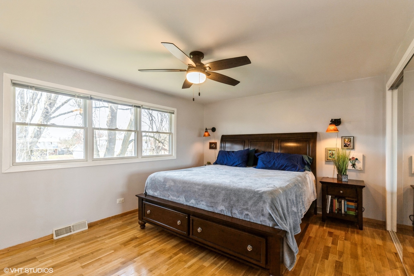506 Beck Road Lindenhurst, IL 60046 - Photo 7 of 15 a bedroom with a bed and a chandelier