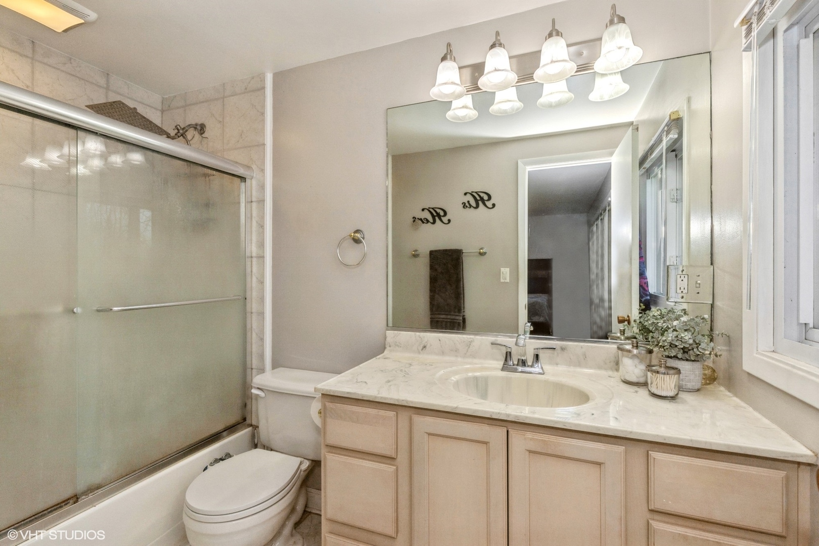 506 Beck Road Lindenhurst, IL 60046 - Photo 8 of 15 a bathroom with a granite countertop sink toilet a mirror a vanity and shower