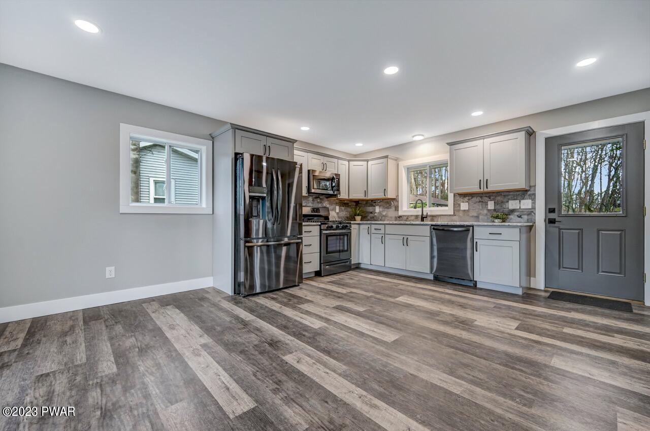 16 Pond Road Moscow, PA 18444 - Photo 20 of 55 a kitchen with stainless steel appliances granite countertop a refrigerator and a stove top oven
