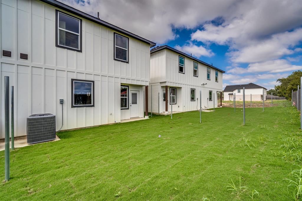 912 Cooksey Court, Unit B Grandview, TX 76050 - Photo 29 of 30 a view of a house with a backyard