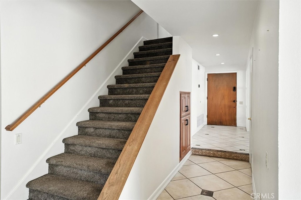 25208 Vía Sistine Valencia, CA 91355 - Photo 19 of 38 Staircase Leading Upstairs