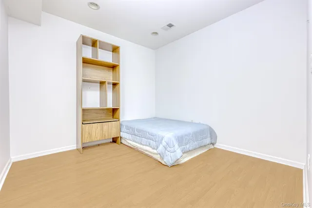 a room with a bed and a window