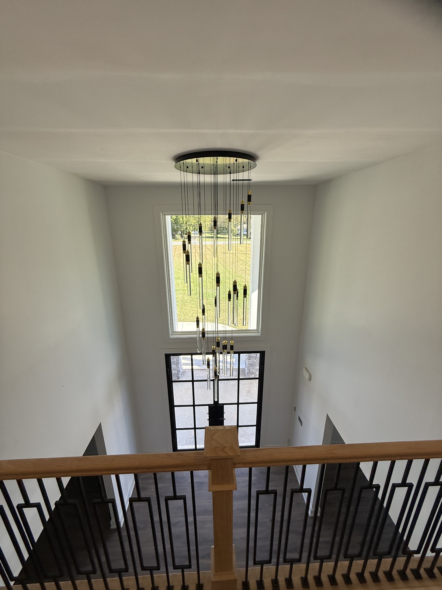 3880 Barfield Crescent Road Murfreesboro, TN 37128 - Photo 12 of 26 a view of a hallway with wooden floor and chandelier