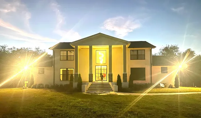 a front view of a house with a yard