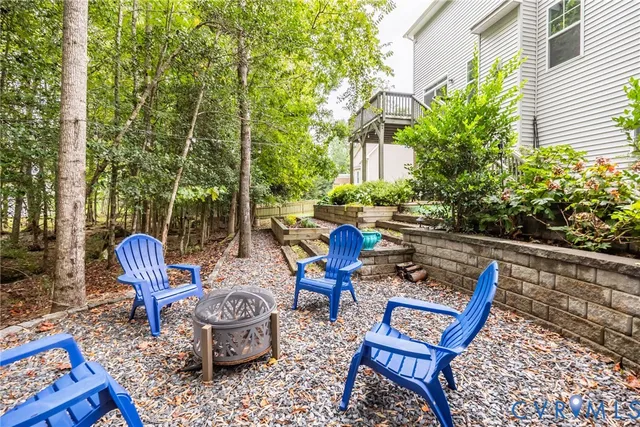 a house view with a sitting space and garden
