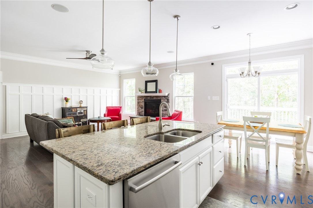 15206 Blackrail Road Chesterfield, VA 23832 - Photo 17 of 50 a kitchen with stainless steel appliances granite countertop a kitchen island a stove and a wooden floors