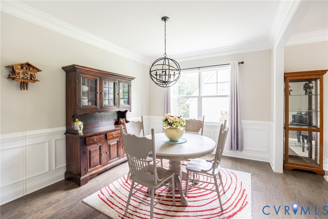 15206 Blackrail Road Chesterfield, VA 23832 - Photo 22 of 50 a view of a dining room with furniture window and wooden floor