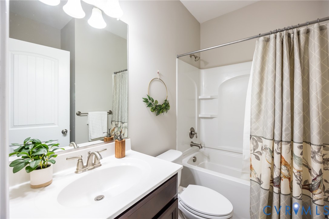 15206 Blackrail Road Chesterfield, VA 23832 - Photo 23 of 50 a bathroom with a sink toilet mirror and shower