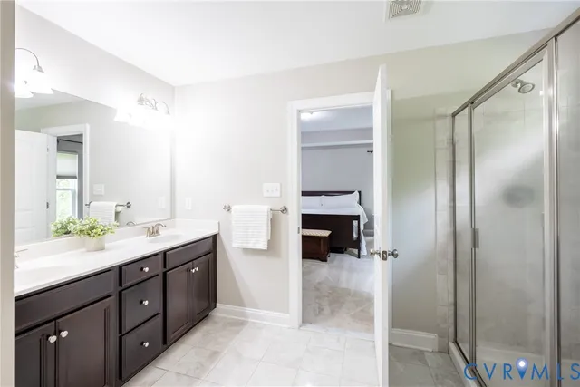 a bathroom with a glass shower door