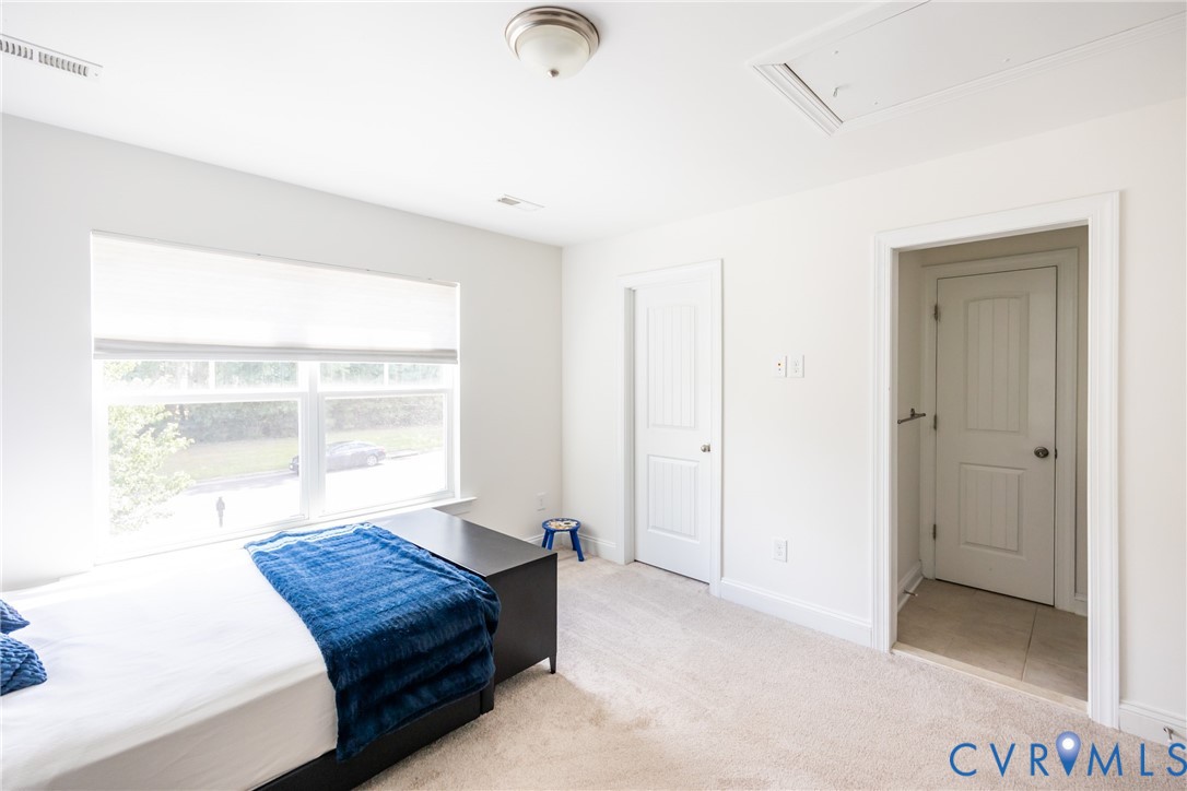 15206 Blackrail Road Chesterfield, VA 23832 - Photo 35 of 50 a living room with a bed and a window