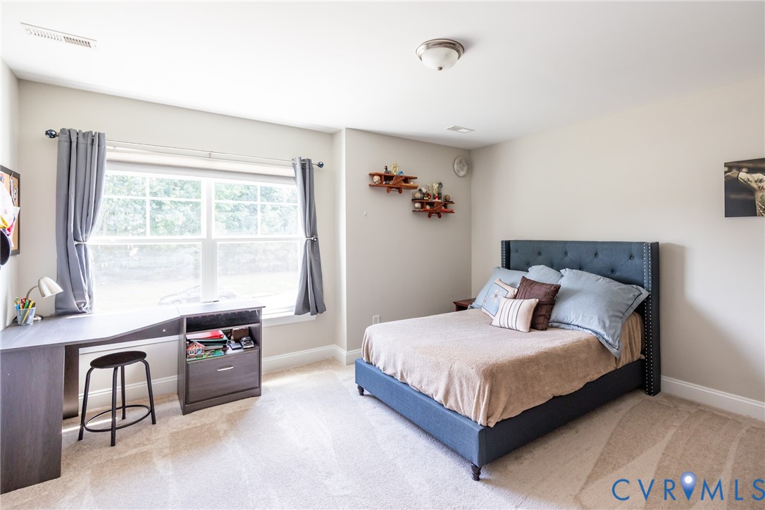 15206 Blackrail Road Chesterfield, VA 23832 - Photo 36 of 50 a bedroom with a bed and a table