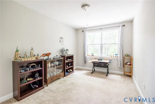a view of a bedroom with furniture and closet