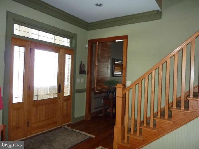 1003 Hiatt Road Winchester, VA 22603 - Photo 2 of 28 a view of an entryway with wooden floor and door