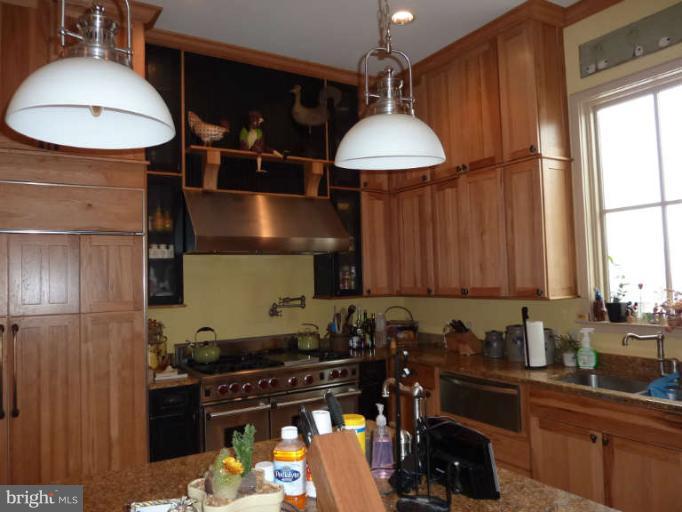 1003 Hiatt Road Winchester, VA 22603 - Photo 11 of 28 a kitchen with a stove a refrigerator and a sink