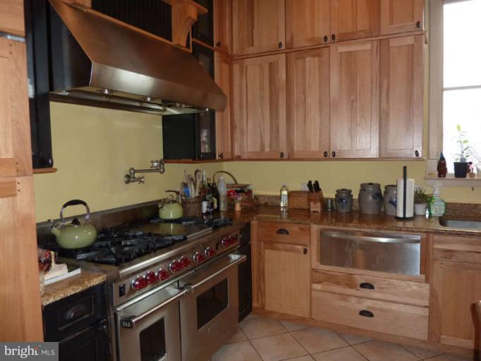 1003 Hiatt Road Winchester, VA 22603 - Photo 13 of 28 a kitchen with granite countertop a stove and a sink
