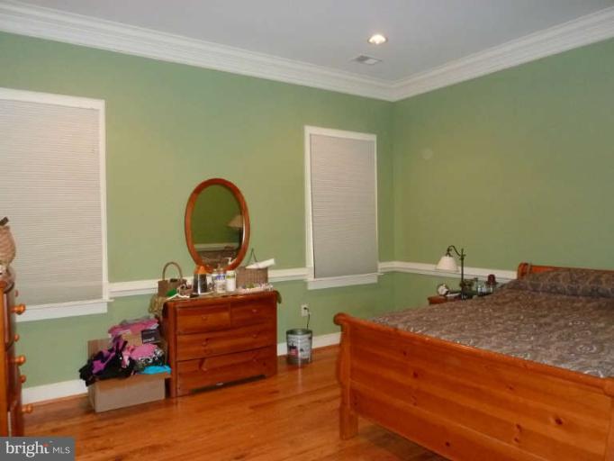 1003 Hiatt Road Winchester, VA 22603 - Photo 21 of 28 a bedroom with a bed and a dresser