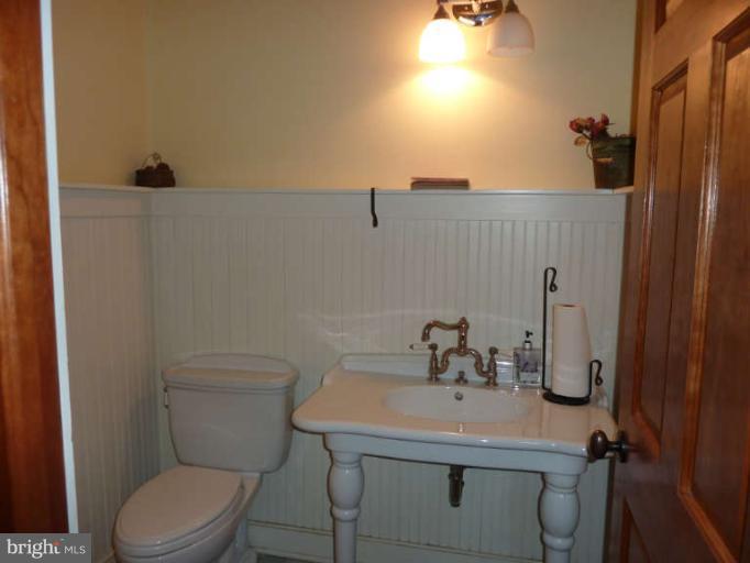 1003 Hiatt Road Winchester, VA 22603 - Photo 24 of 28 a bathroom with a sink toilet and mirror