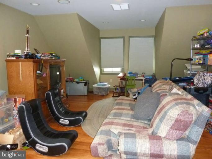 1003 Hiatt Road Winchester, VA 22603 - Photo 25 of 28 a bed room with two bed and a chair