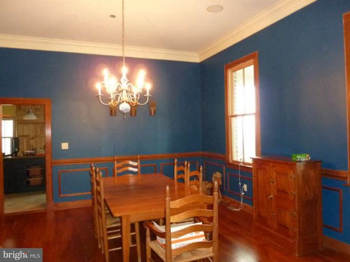 1003 Hiatt Road Winchester, VA 22603 - Photo 4 of 28 a view of a dining room with furniture and chandelier