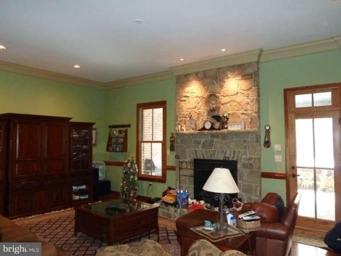 1003 Hiatt Road Winchester, VA 22603 - Photo 6 of 28 a living room with furniture and a fireplace