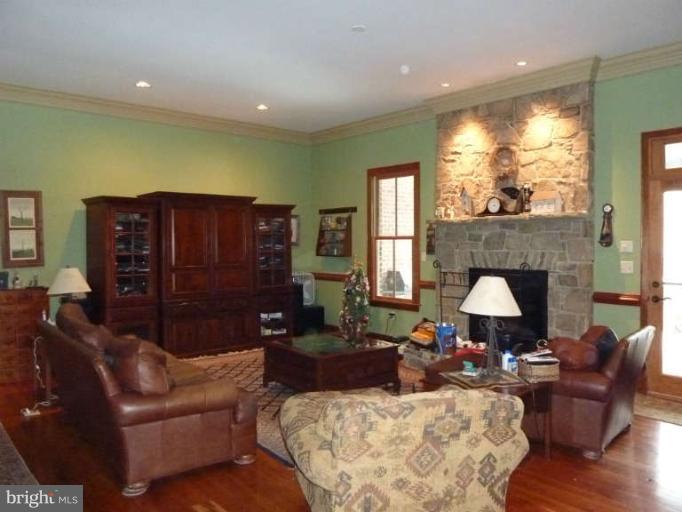 1003 Hiatt Road Winchester, VA 22603 - Photo 7 of 28 a living room with furniture window and a fireplace