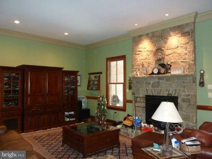 1003 Hiatt Road Winchester, VA 22603 - Photo 8 of 28 a living room with furniture and a fireplace