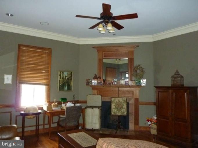 1003 Hiatt Road Winchester, VA 22603 - Photo 9 of 28 a living room with fireplace furniture and a chandelier