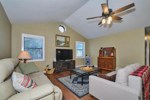 a large kitchen with kitchen island a stove a sink a dining table and chairs