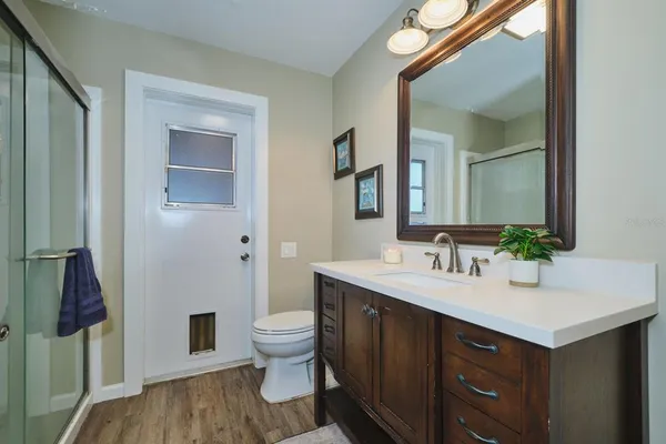 a kitchen with cabinets and window