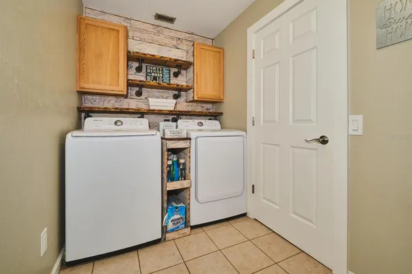 a view of a storage & utility room with washer and dryer