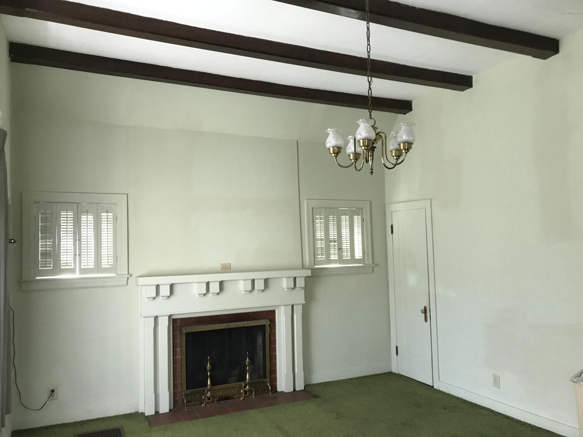 905 Greenleaf Road Louisville, KY 40213 - Photo 4 of 28 Huge living room with 11 ft ceiling and gas fireplace