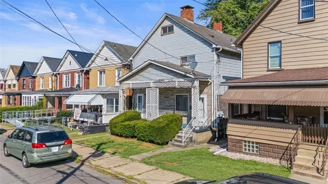 a front view of a house with garden