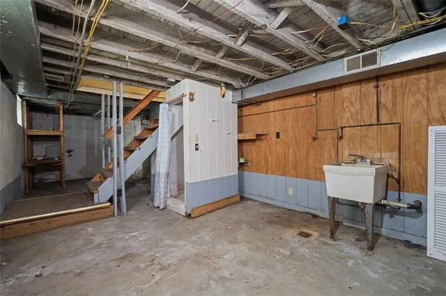 a kitchen with granite countertop a stove cabinets and a sink