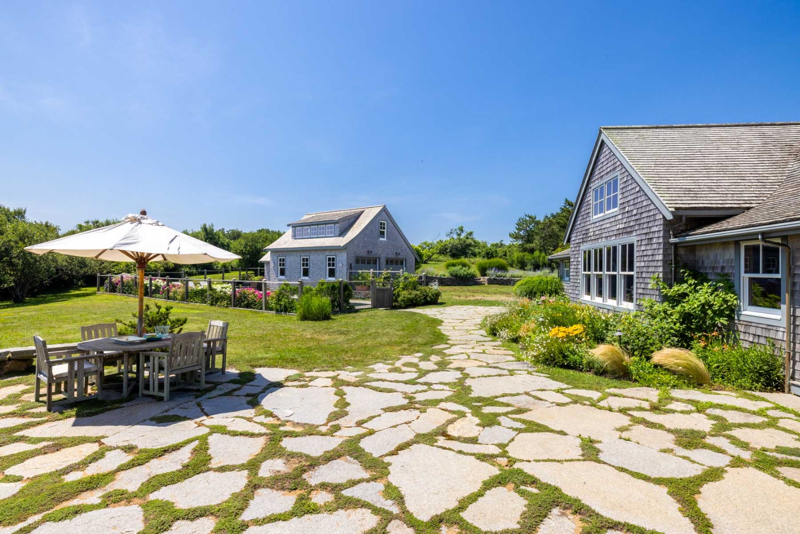 64 Squibnocket Farm Road Chilmark, MA 02535 - Photo 16 of 43 a view of a house with garden and sitting area