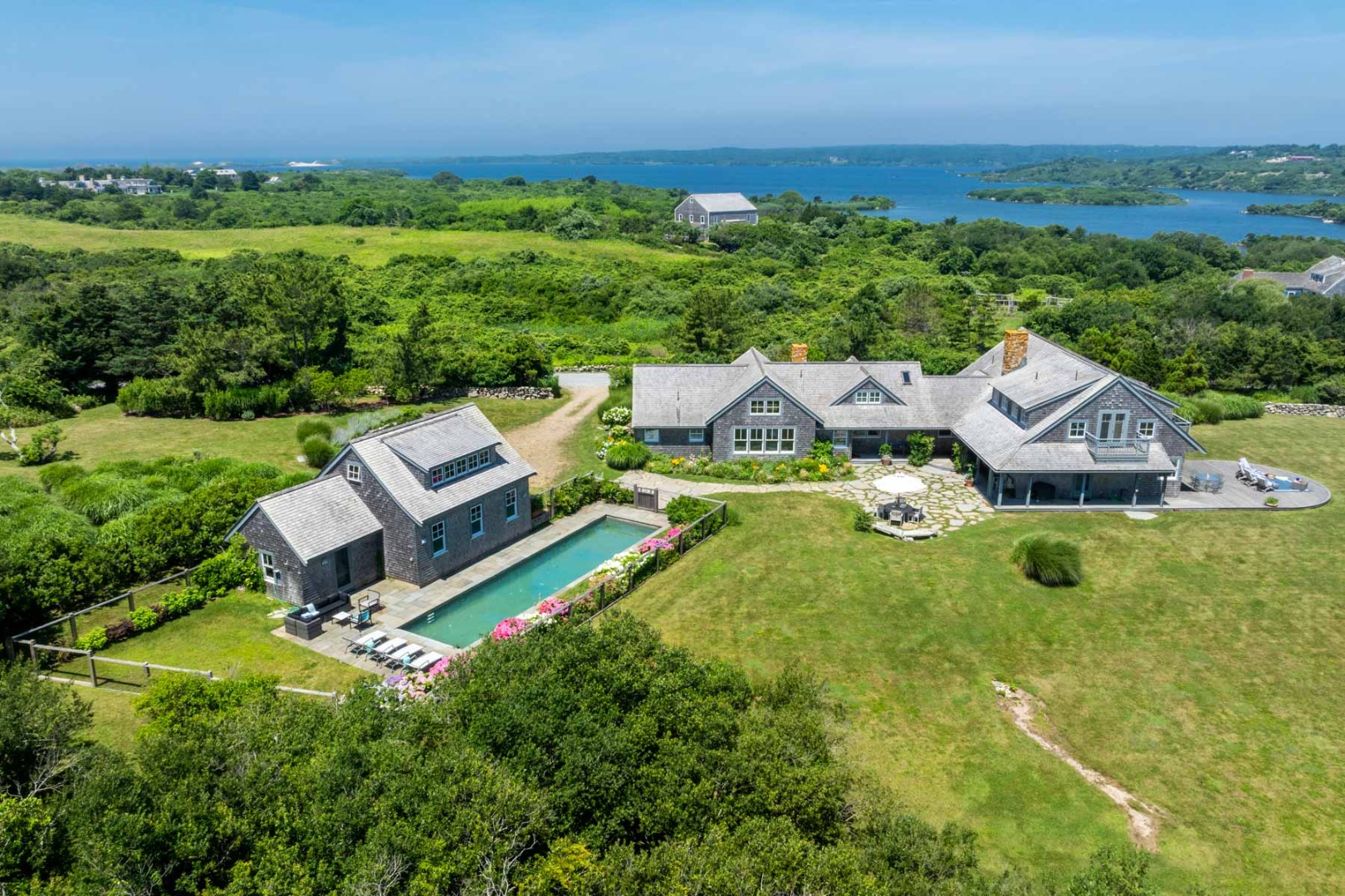 64 Squibnocket Farm Road Chilmark, MA 02535 - Photo 23 of 43 an aerial view of a house with pool big yard and large trees