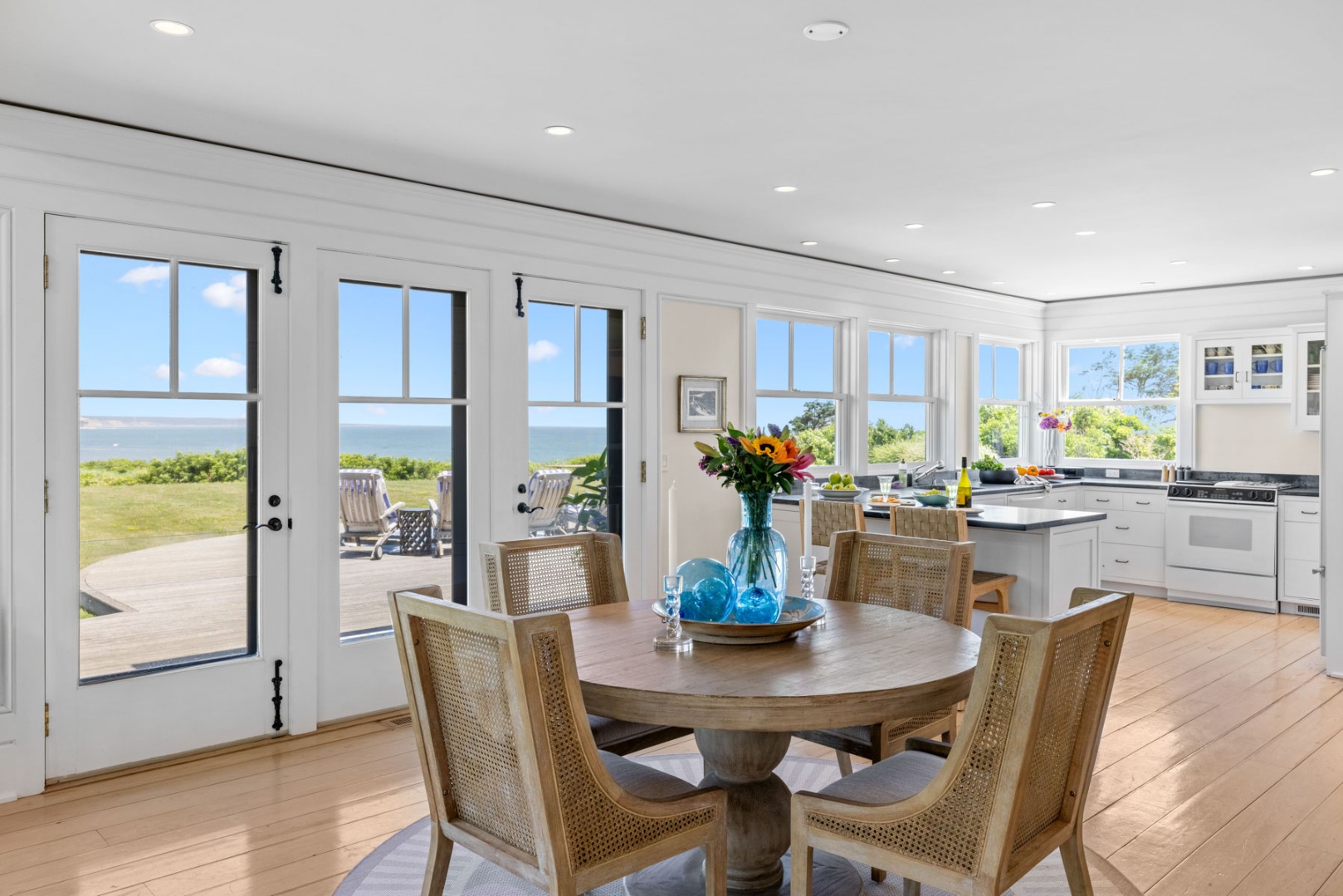 64 Squibnocket Farm Road Chilmark, MA 02535 - Photo 26 of 43 a dining room with furniture a window and wooden floor