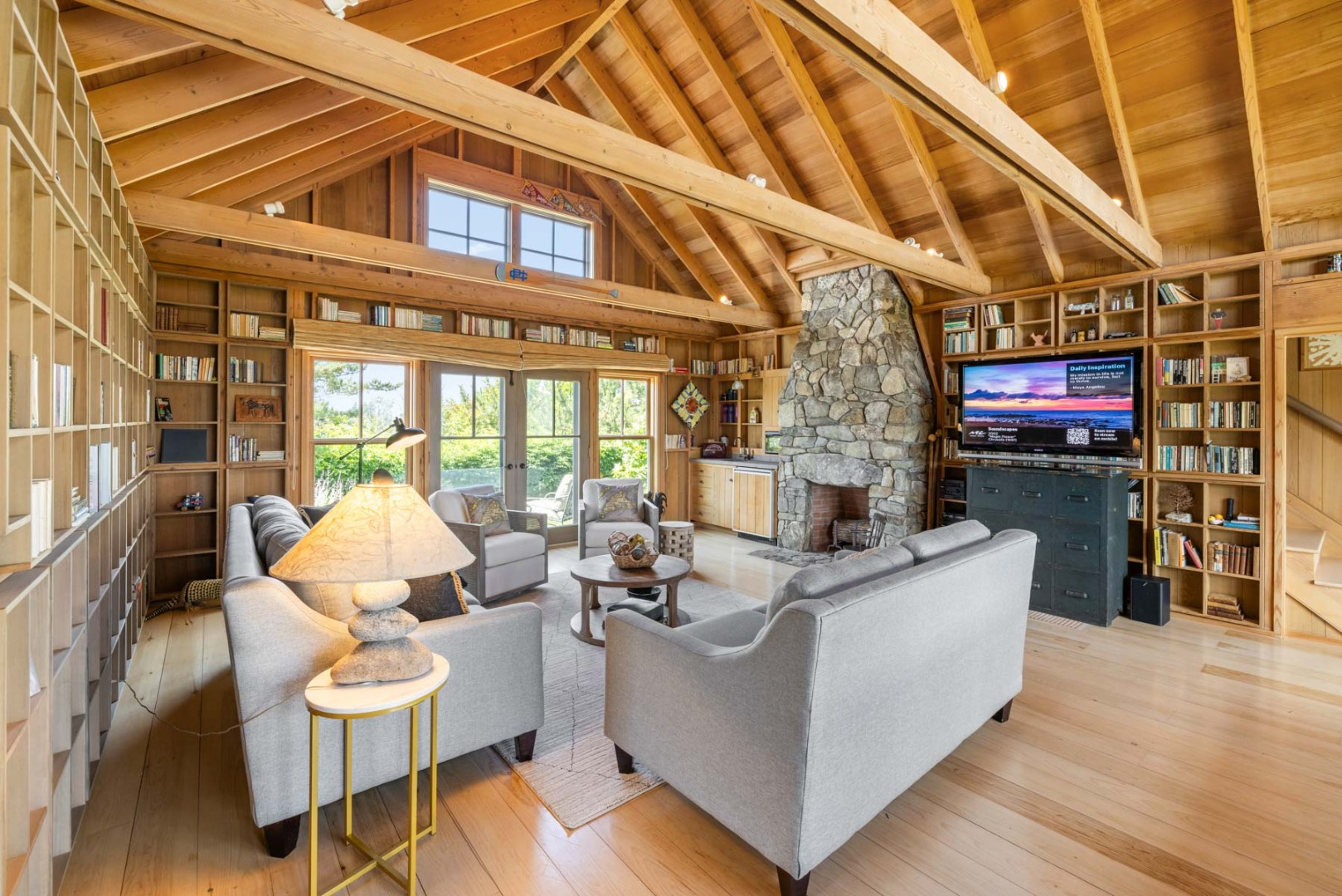 64 Squibnocket Farm Road Chilmark, MA 02535 - Photo 34 of 43 a living room with fireplace furniture and a floor to ceiling window