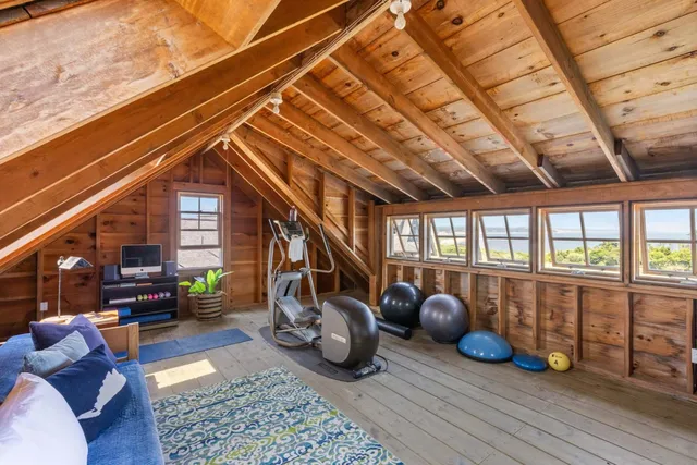 a room with lots of furniture and a rug