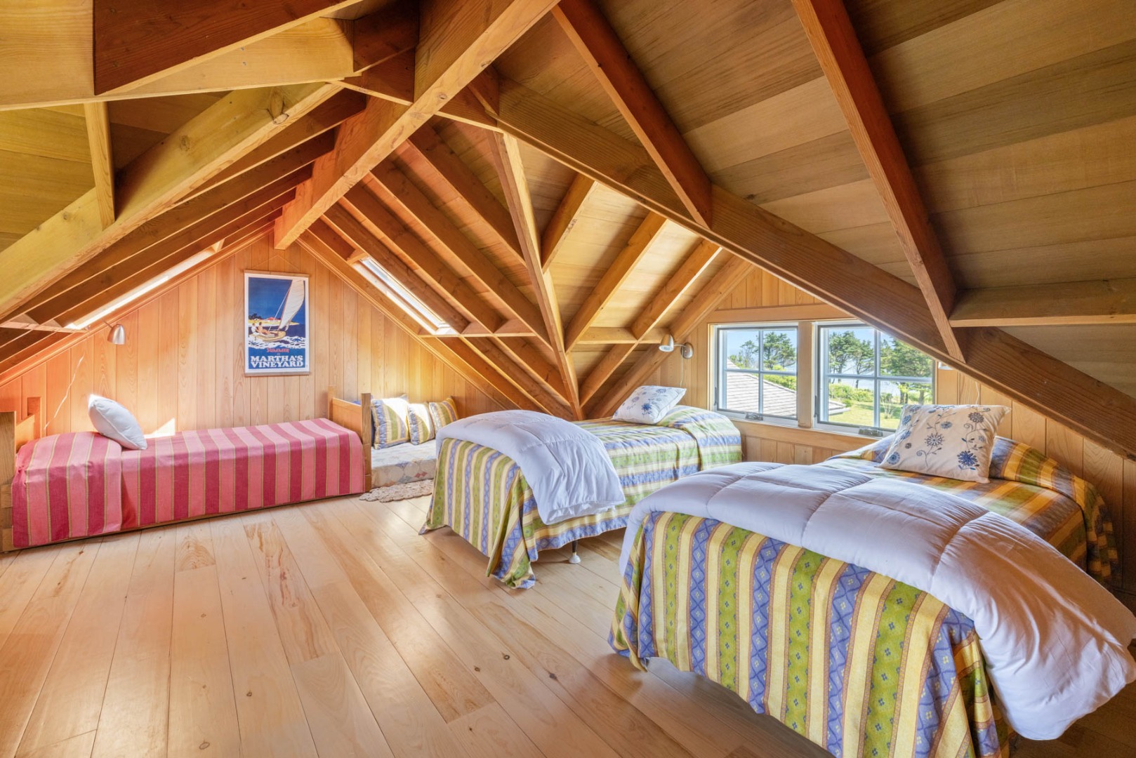 64 Squibnocket Farm Road Chilmark, MA 02535 - Photo 42 of 43 a view of a balcony with two couches and chairs with wooden floor