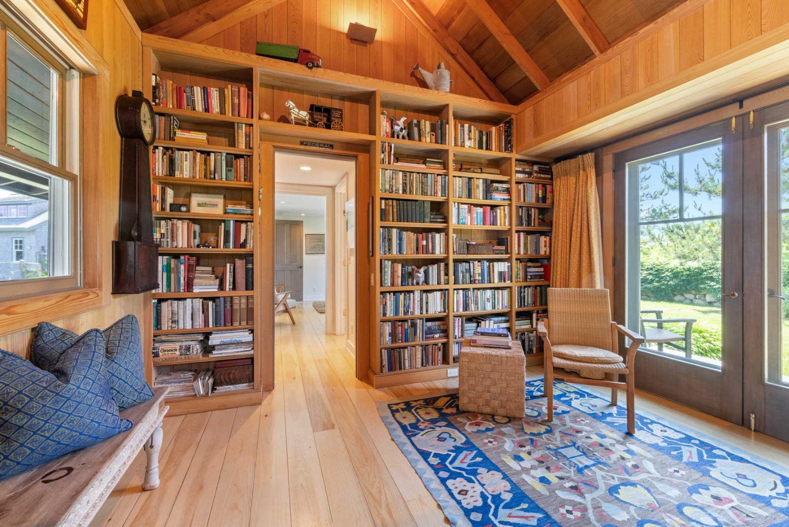 64 Squibnocket Farm Road Chilmark, MA 02535 - Photo 43 of 43 a living room with furniture and a book shelf