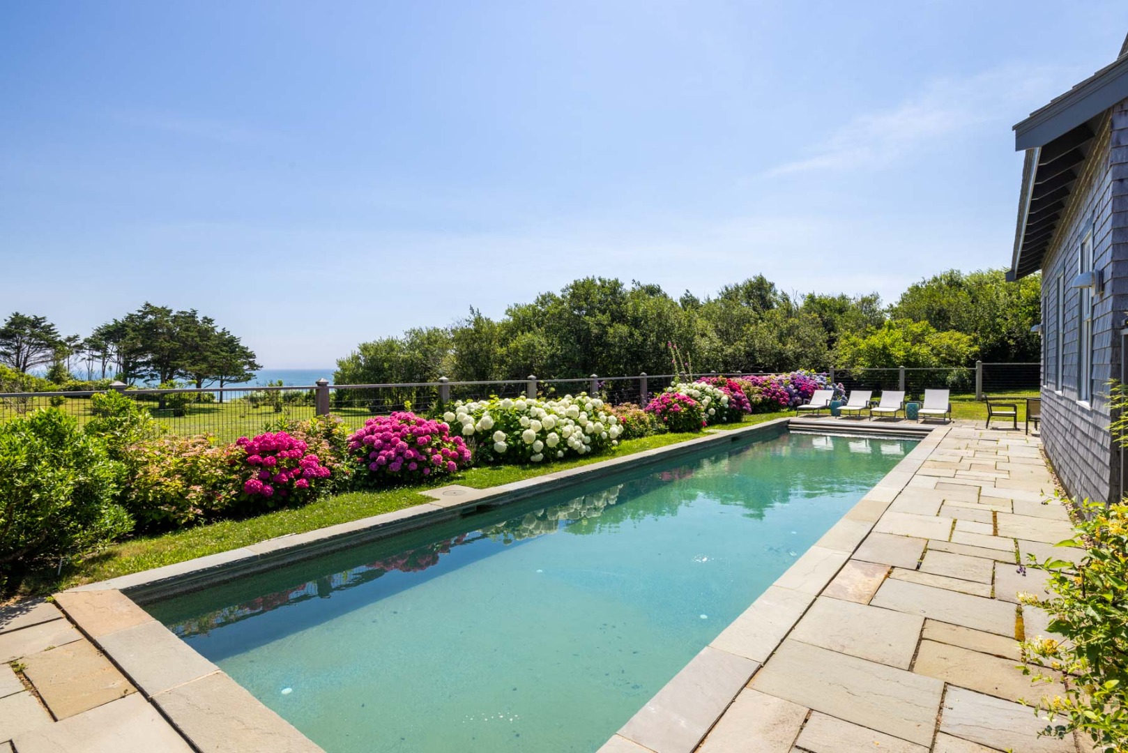 64 Squibnocket Farm Road Chilmark, MA 02535 - Photo 5 of 43 a view of swimming pool from a balcony