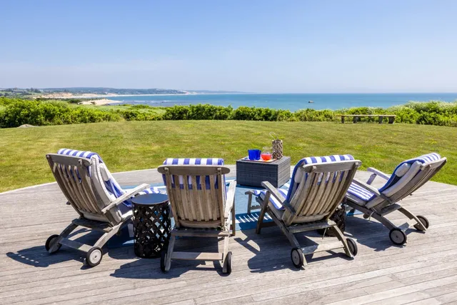 a view of a chairs and table on the terrace