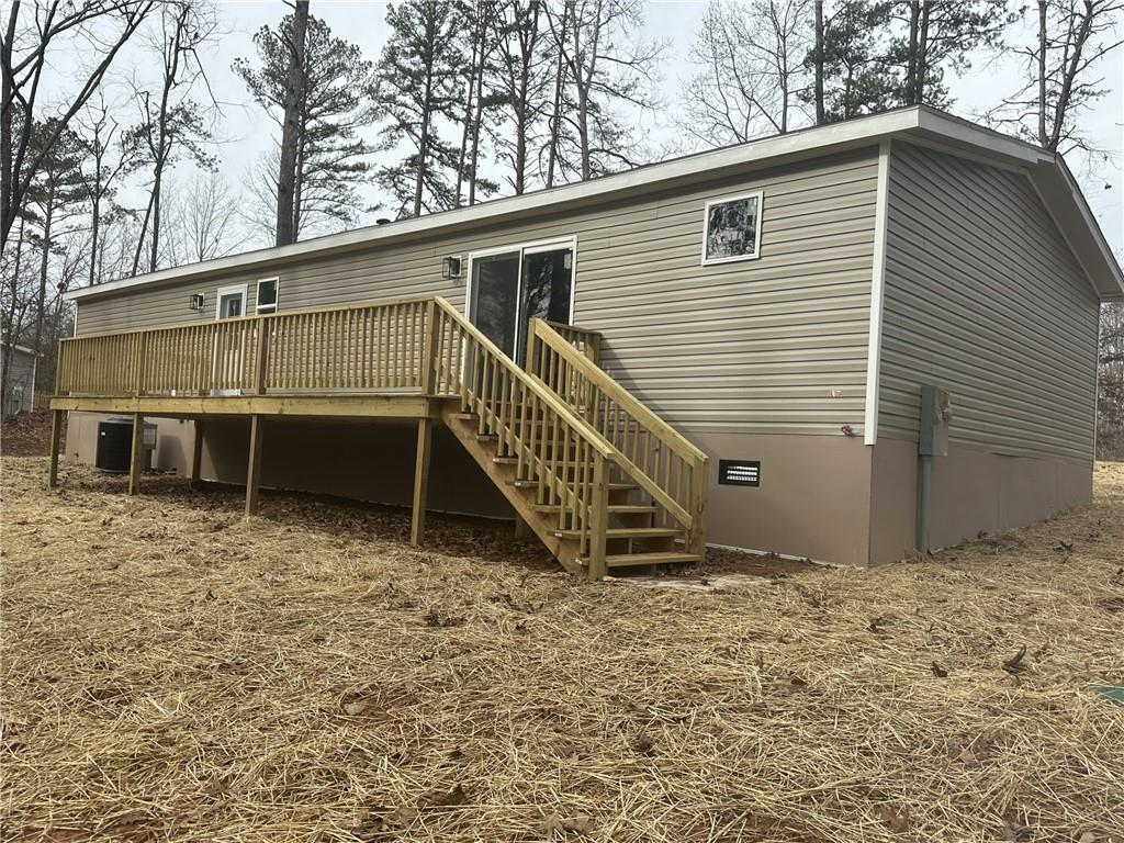 7463 Yukon Road Talking Rock, GA 30175 - Photo 5 of 5 a view of a house with a yard