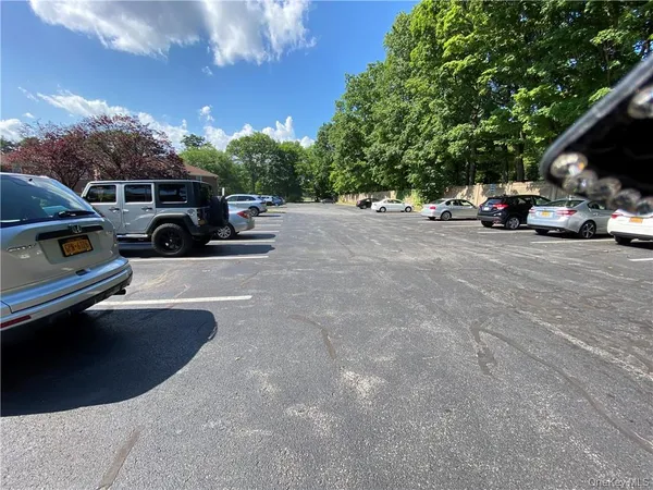 a view of street with parked cars