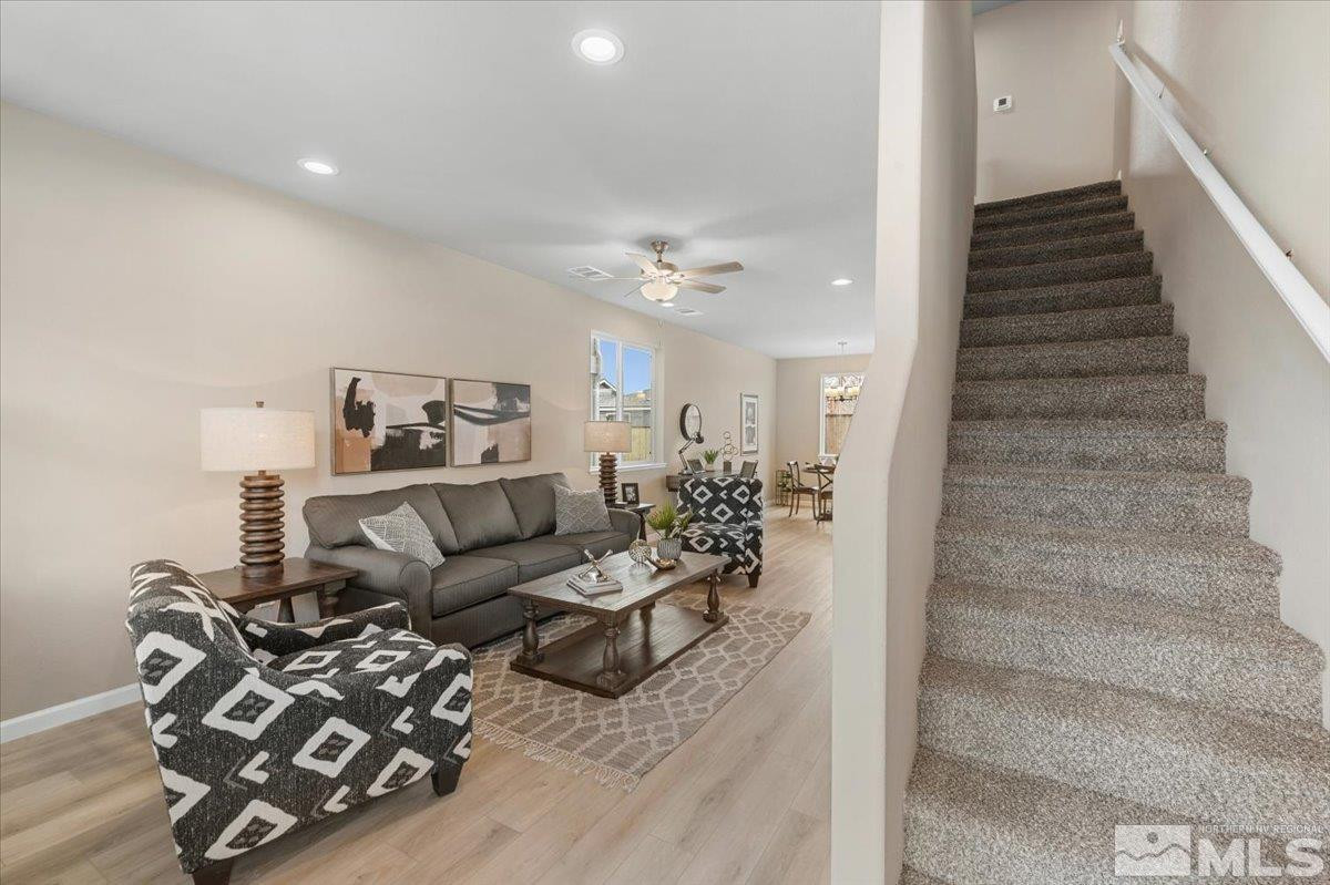 1164 Arrastra Road, Unit LOT 19 Reno, NV 89512 - Photo 17 of 34 a living room with furniture and a chandelier