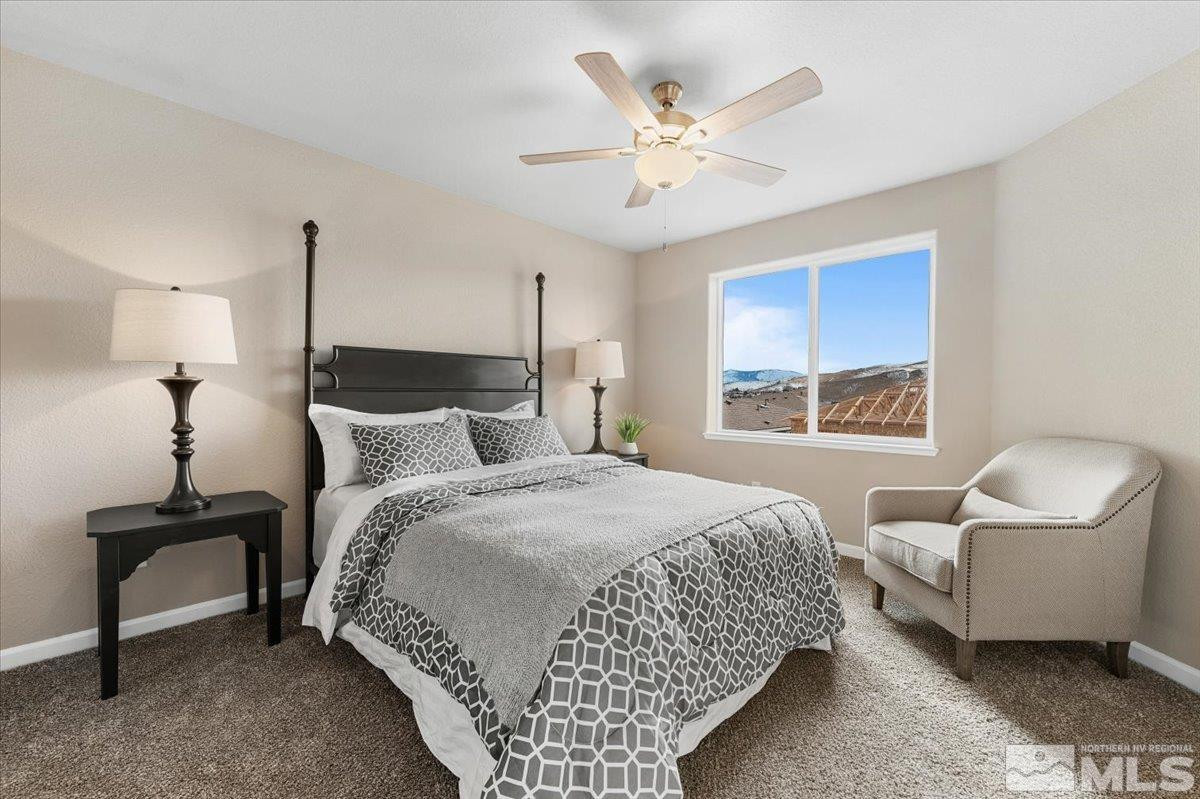 1164 Arrastra Road, Unit LOT 19 Reno, NV 89512 - Photo 18 of 34 a bedroom with a bed and a chair